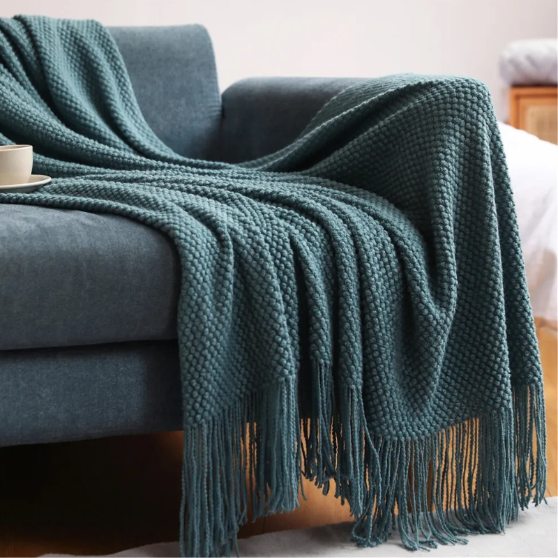 Luxury merino-style blanket with tassels and textured nubs; plush, elegant design perfect for home decor and warmth.
