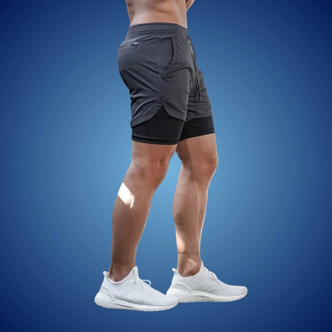 "Men's breathable sports running shorts, black, moisture-wicking fabric, ideal for gym or trail, with spacious pockets."