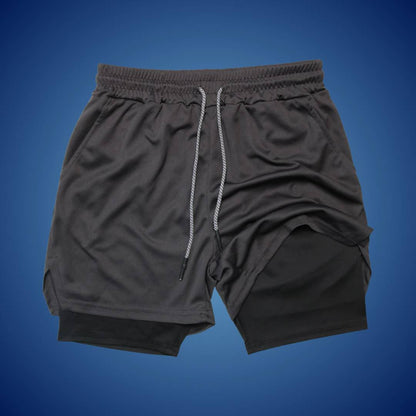 "Men's breathable sports running shorts, black, moisture-wicking fabric, ideal for gym or trail, with spacious pockets."