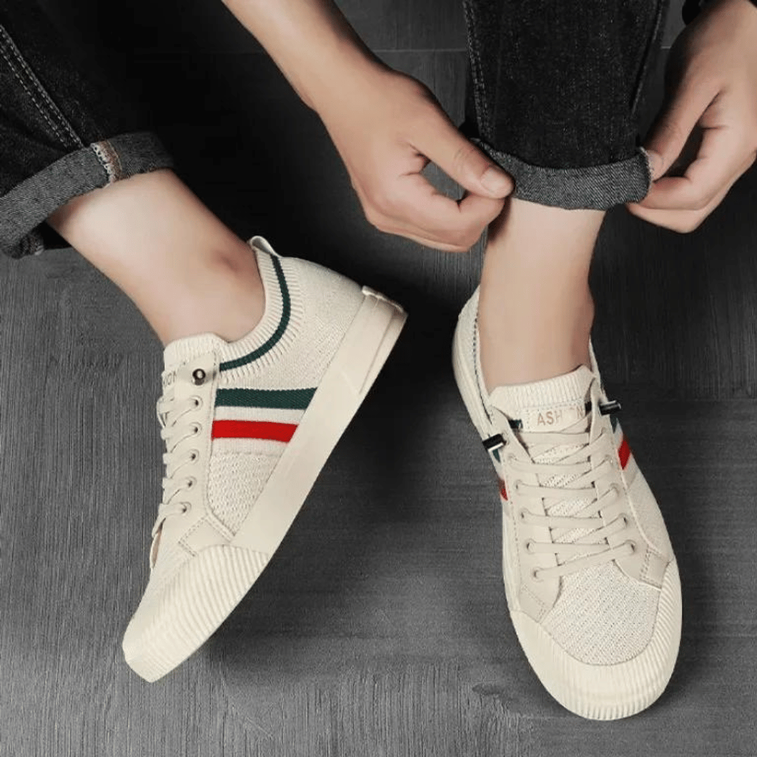 "Men’s casual sneakers in breathable knit fabric, lace-up design with durable rubber sole, perfect for everyday comfort."