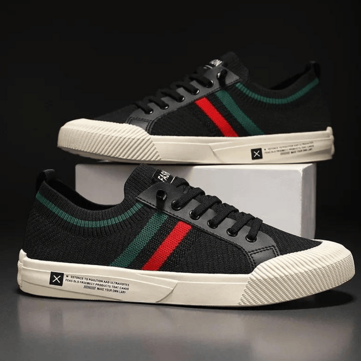 "Men’s casual sneakers in breathable knit fabric, lace-up design with durable rubber sole, perfect for everyday comfort."