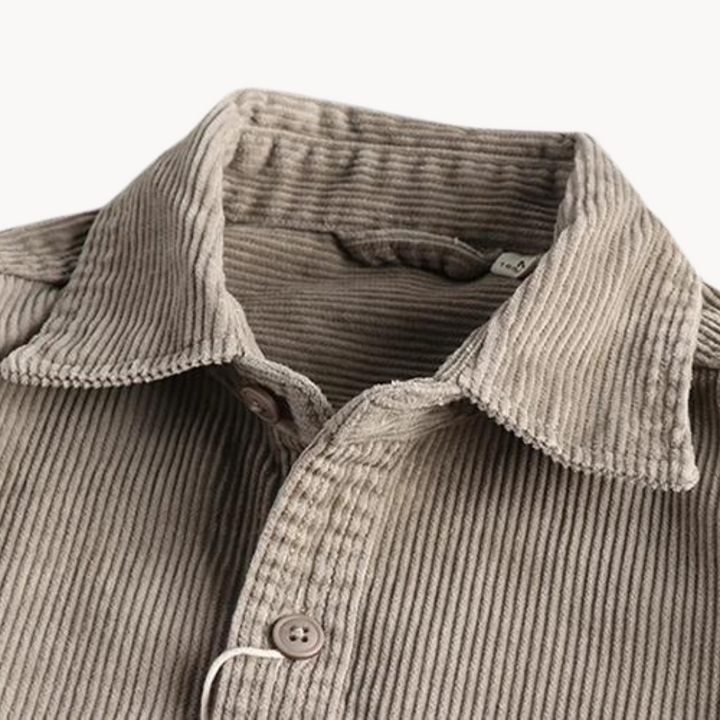 Men's classic orange corduroy shirt with button-down front and textured fabric, ideal for layering and timeless style.