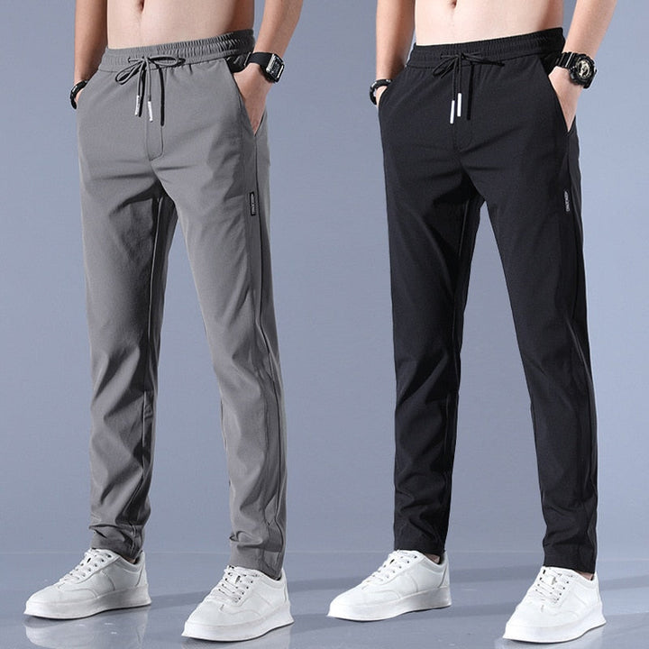 Men's cotton chino pants with a sleek, modern fit in versatile shades, perfect for formal or casual occasions.