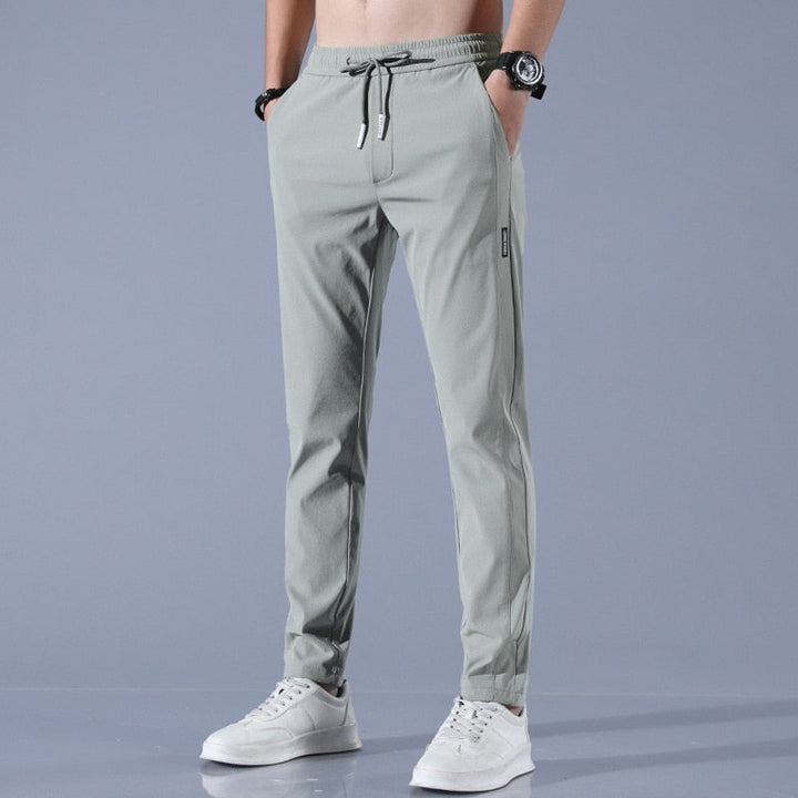 Men's cotton chino pants with a sleek, modern fit in versatile shades, perfect for formal or casual occasions.