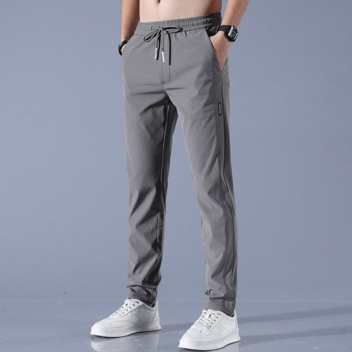 Men's cotton chino pants with a sleek, modern fit in versatile shades, perfect for formal or casual occasions.