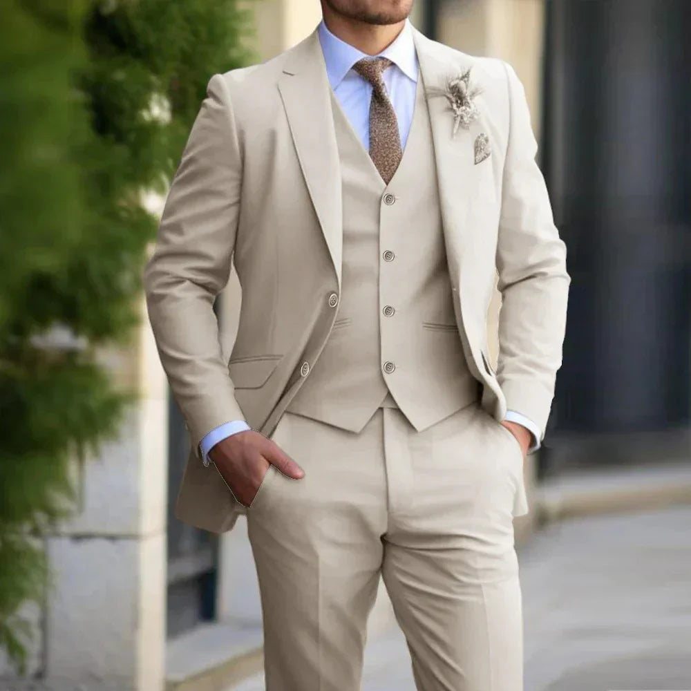 Men's elegant 3-piece slim fit suit in beige; includes blazer, vest, trousers. Ideal for formal occasions. Sophisticated styl