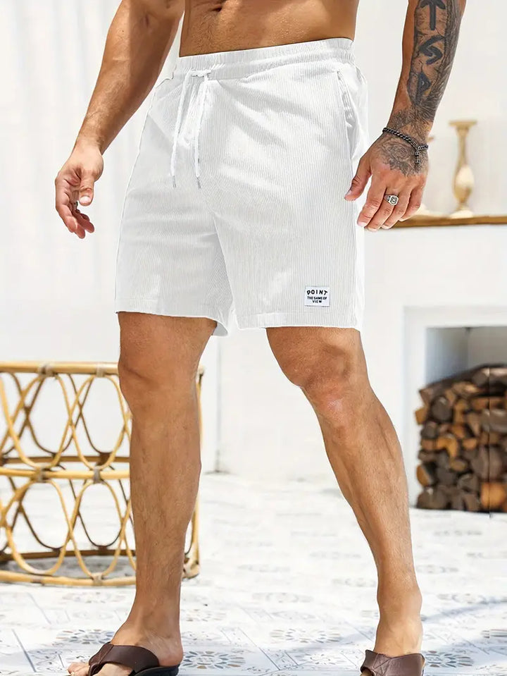 "Men's loose-fit corduroy shorts with drawstring waist in various colors, soft texture, relaxed fit for casual wear."