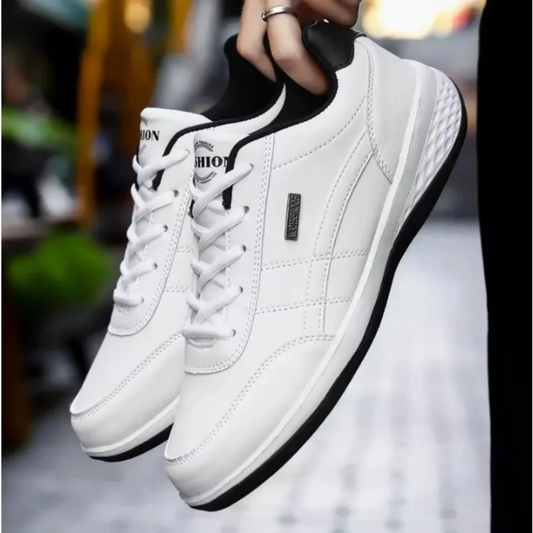 "Men's orthopedic leather sneakers in white, offering comfort, style, and orthopedic support, with breathable design."