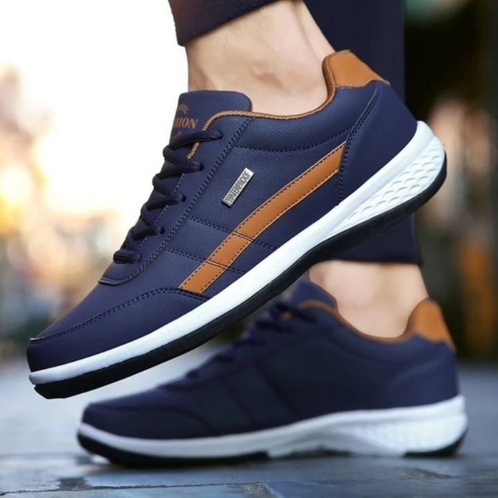 "Men's orthopedic leather sneakers in white, offering comfort, style, and orthopedic support, with breathable design."