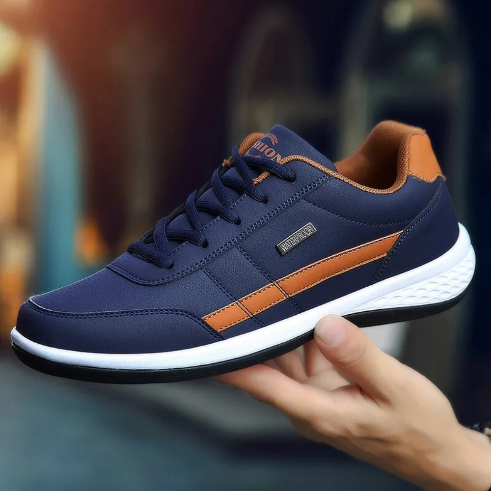 "Men's orthopedic leather sneakers in white, offering comfort, style, and orthopedic support, with breathable design."