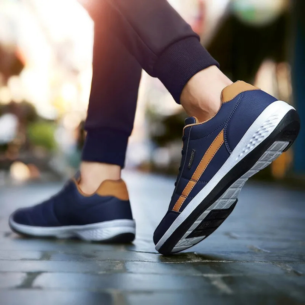 "Men's orthopedic leather sneakers in white, offering comfort, style, and orthopedic support, with breathable design."