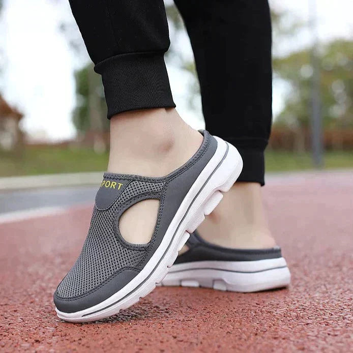 "Men's orthopedic slip-on slippers with ergonomic sole, sleek design, cushioned padding, for ultimate comfort and support."