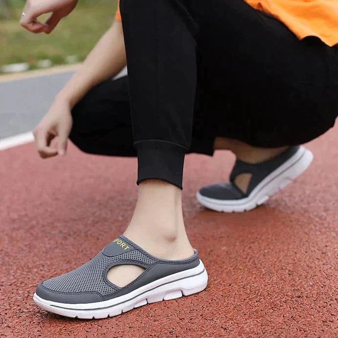 "Men's orthopedic slip-on slippers with ergonomic sole, sleek design, cushioned padding, for ultimate comfort and support."
