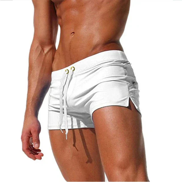 "Men's quick-dry swim shorts with adjustable waistband, sleek design, side slits, and drawstring closure for swim comfort."