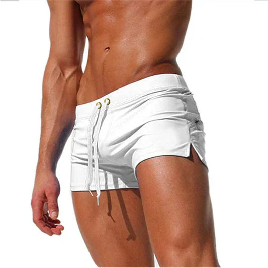 "Men's quick-dry swim shorts with adjustable waistband, sleek design, side slits, and drawstring closure for swim comfort."