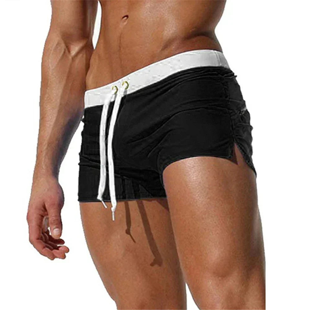 "Men's quick-dry swim shorts with adjustable waistband, sleek design, side slits, and drawstring closure for swim comfort."