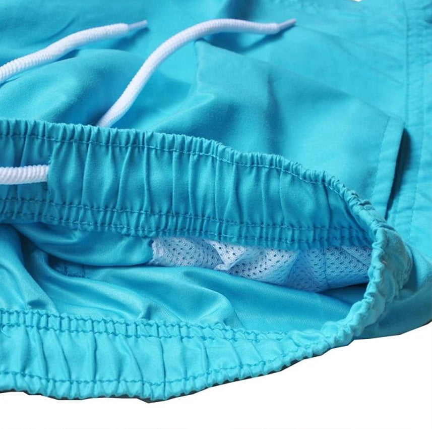 "Men's quick-dry swim trunks with trendy design, elastic waistband, colorful patterns, ideal for beach or pool activities."