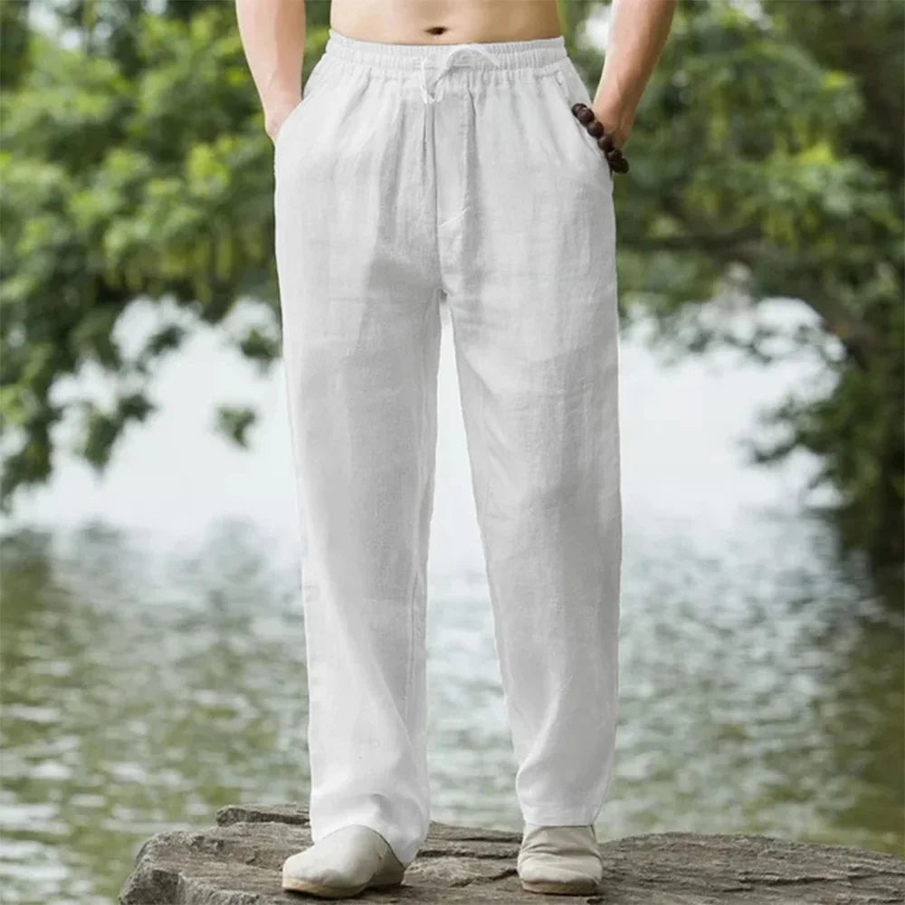 Men's relaxed linen beach pants, lightweight and airy with adjustable drawstring, perfect for casual summer comfort.