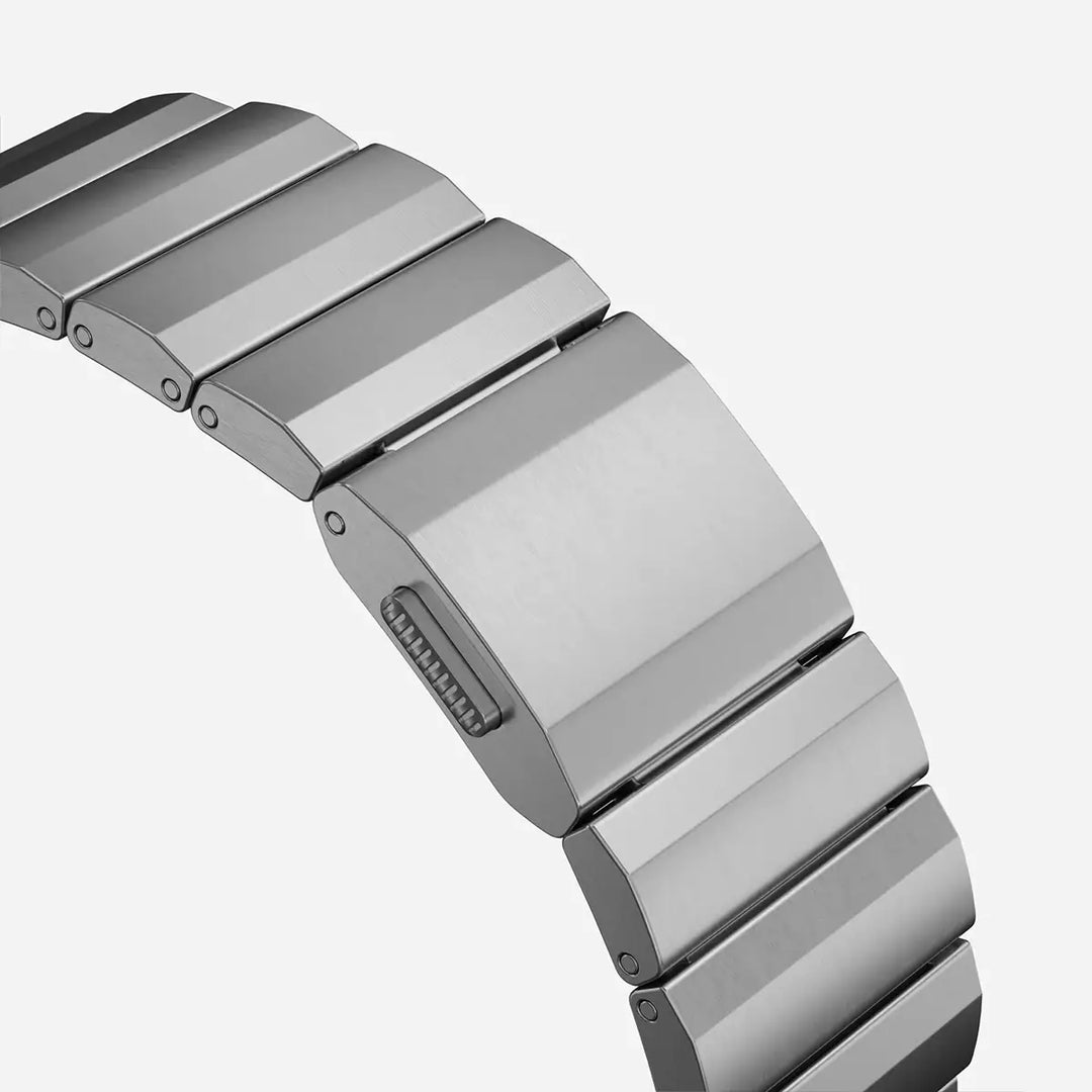 Men's sleek titanium watch band with shiny finish, magnetic clasp, durable and lightweight; perfect for daily or formal wear.
