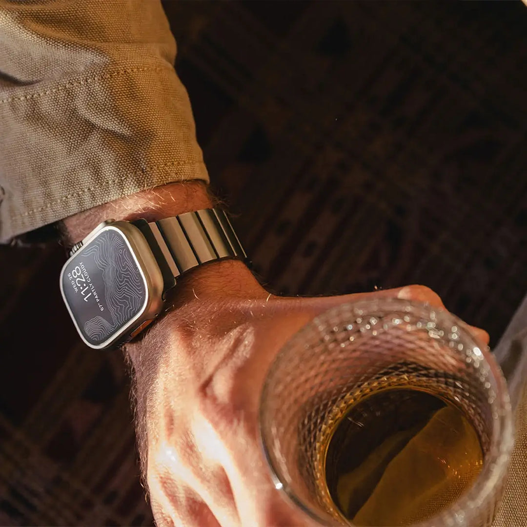 Men's sleek titanium watch band with shiny finish, magnetic clasp, durable and lightweight; perfect for daily or formal wear.