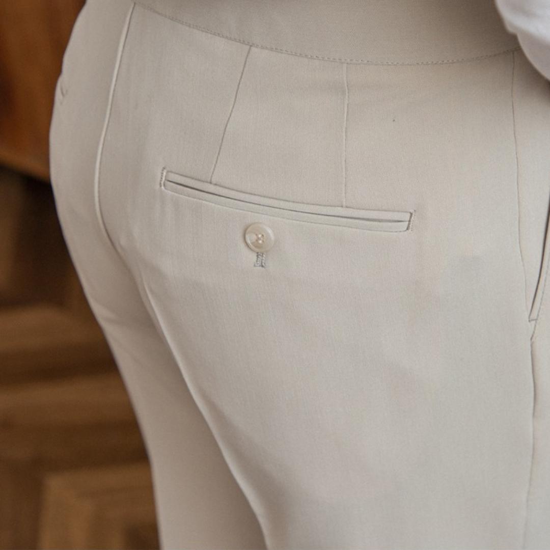 Men’s tailored essential trousers in classic colors, streamlined fit, perfect for formal or casual wear, showcasing elegance.