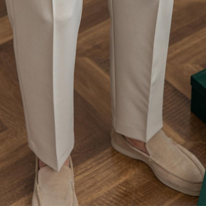 Men’s tailored essential trousers in classic colors, streamlined fit, perfect for formal or casual wear, showcasing elegance.