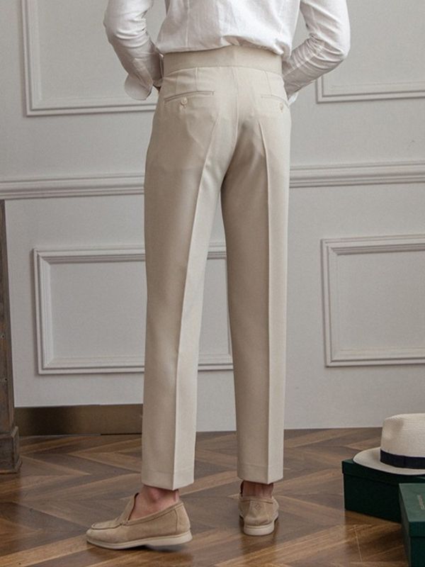 Men’s tailored essential trousers in classic colors, streamlined fit, perfect for formal or casual wear, showcasing elegance.