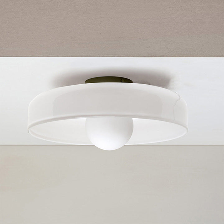 "Minimal flush mount ceiling light with frosted shade, sleek finish, offers soft illumination; ideal for modern and tradition