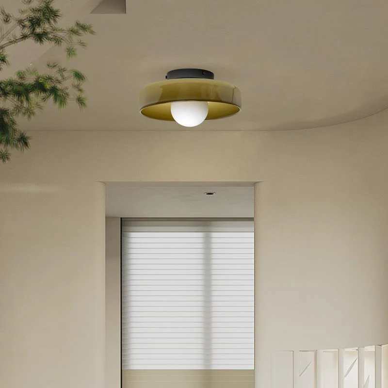 "Minimal flush mount ceiling light with frosted shade, sleek finish, offers soft illumination; ideal for modern and tradition