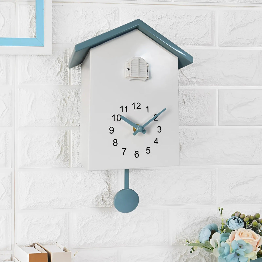 "Minimalist cuckoo wall clock with sleek black and white finish, modern design, whimsical bird element, compact 20x25cm size.