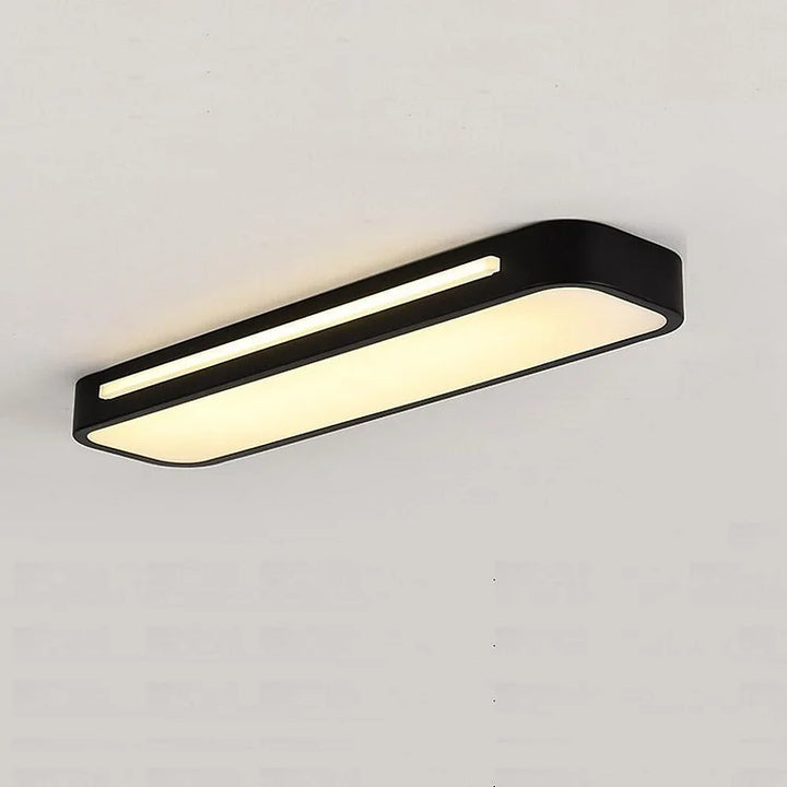 "Minimalist Nordic long LED ceiling light with sleek black finish and modern design for elegant interior lighting"