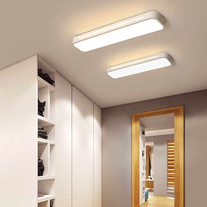 "Minimalist Nordic long LED ceiling light with sleek black finish and modern design for elegant interior lighting"