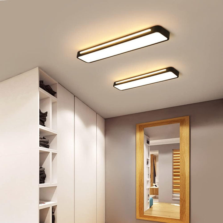 "Minimalist Nordic long LED ceiling light with sleek black finish and modern design for elegant interior lighting"