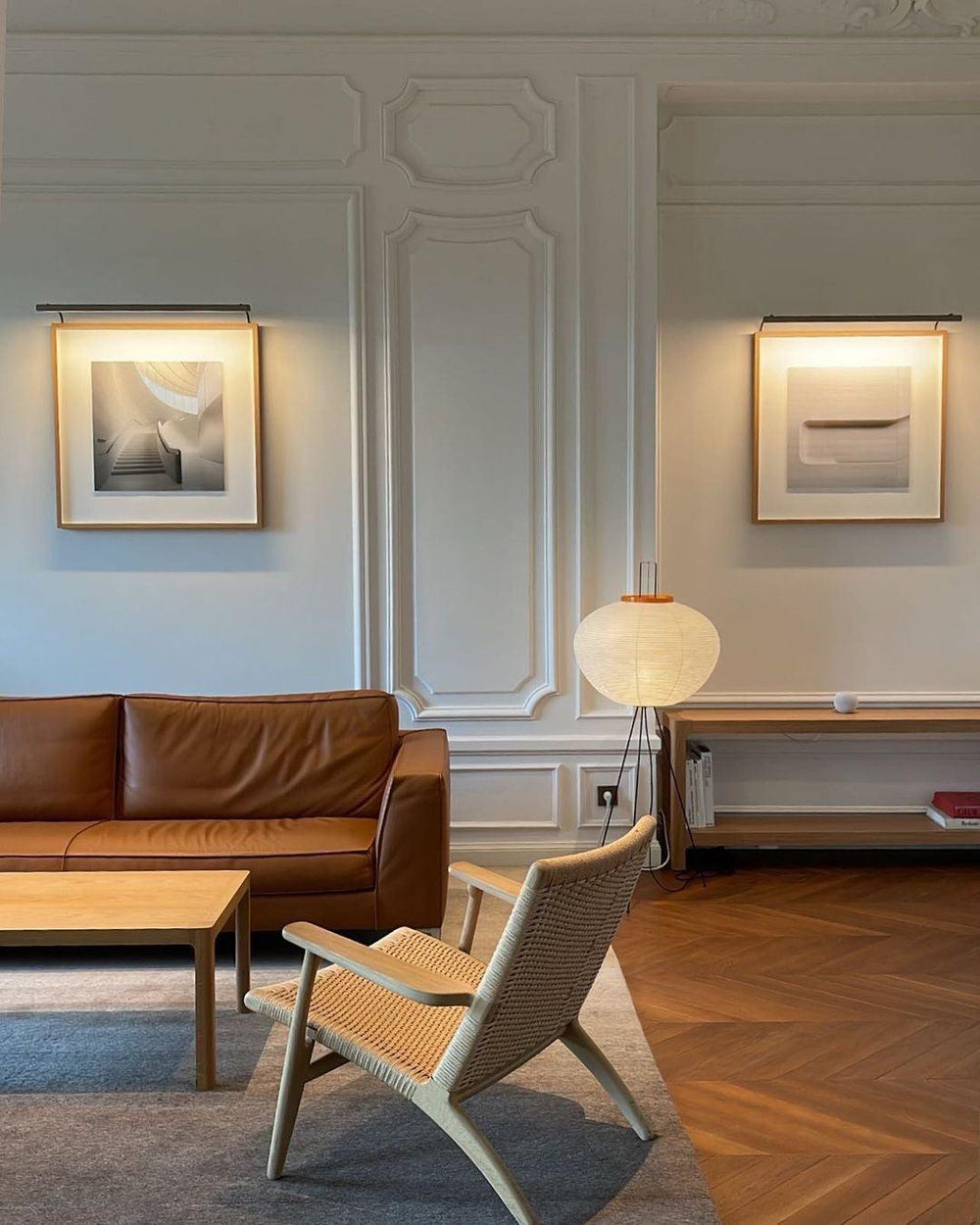 "Minimalist rice paper floor lamp with sleek metal frame and soft diffused light, perfect for creating a warm ambiance."