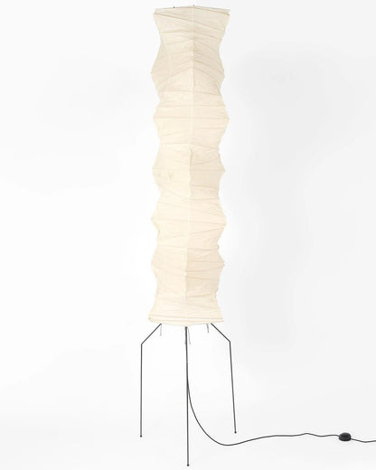 "Minimalist rice paper floor lamp with sleek metal frame and soft diffused light, perfect for creating a warm ambiance."