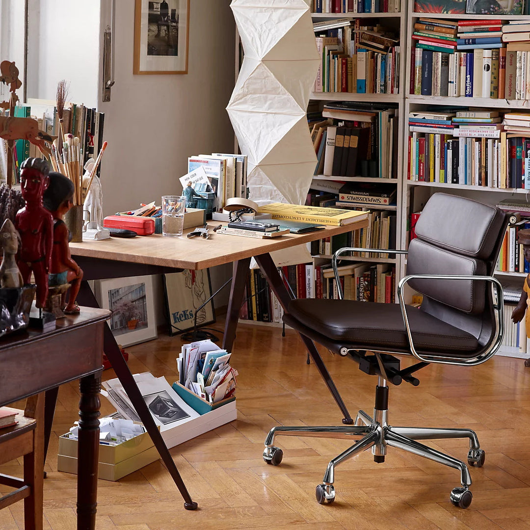 "Minimalist rice paper floor lamp with sleek metal frame and soft diffused light, perfect for creating a warm ambiance."