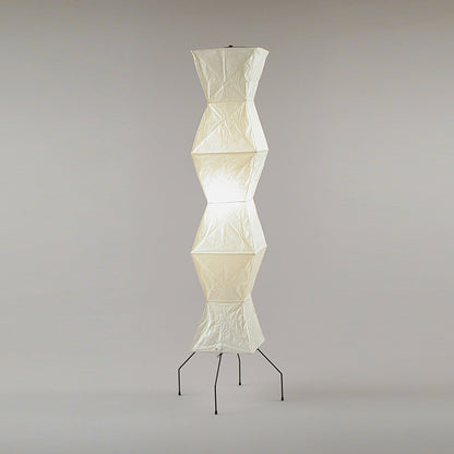 "Minimalist rice paper floor lamp with sleek metal frame and soft diffused light, perfect for creating a warm ambiance."