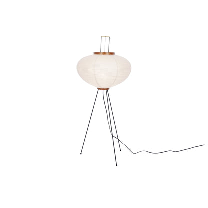 "Minimalist rice paper floor lamp with sleek metal frame and soft diffused light, perfect for creating a warm ambiance."