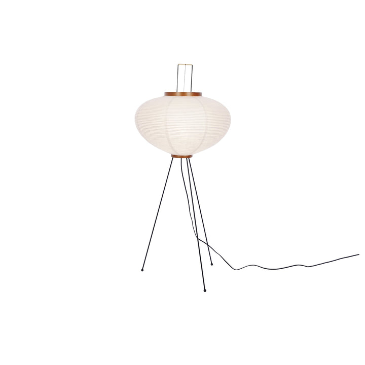 "Minimalist rice paper floor lamp with sleek metal frame and soft diffused light, perfect for creating a warm ambiance."