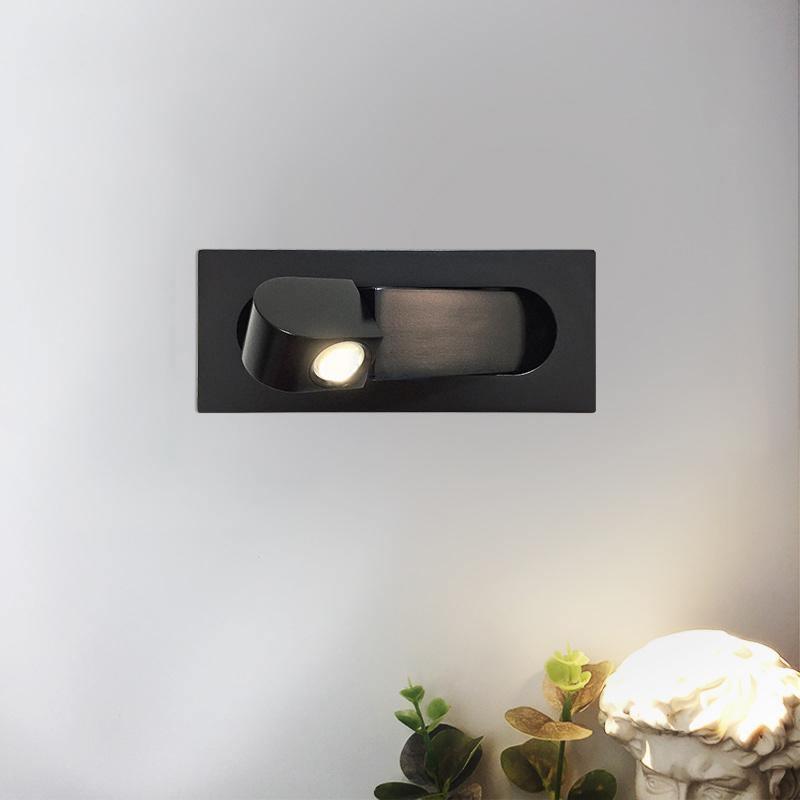 Modern adjustable LED bedside lamp in matte black with a sleek design, featuring an adjustable head for focused reading light