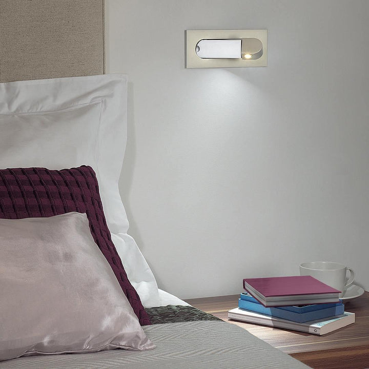 Modern adjustable LED bedside lamp in matte black with a sleek design, featuring an adjustable head for focused reading light