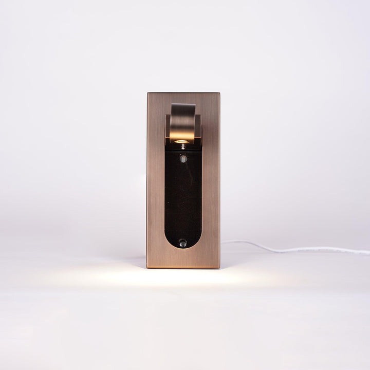 Modern adjustable LED bedside lamp in matte black with a sleek design, featuring an adjustable head for focused reading light
