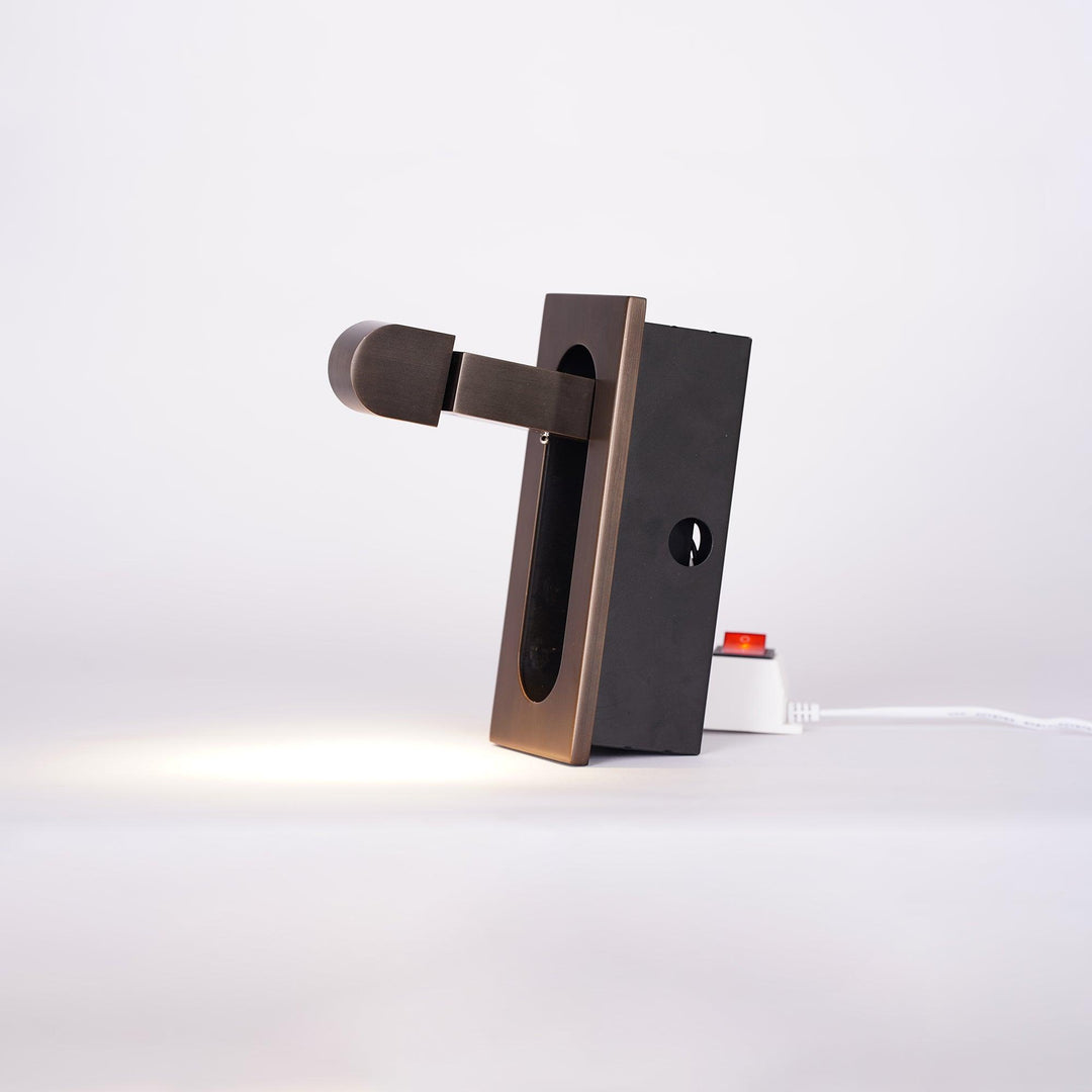 Modern adjustable LED bedside lamp in matte black with a sleek design, featuring an adjustable head for focused reading light