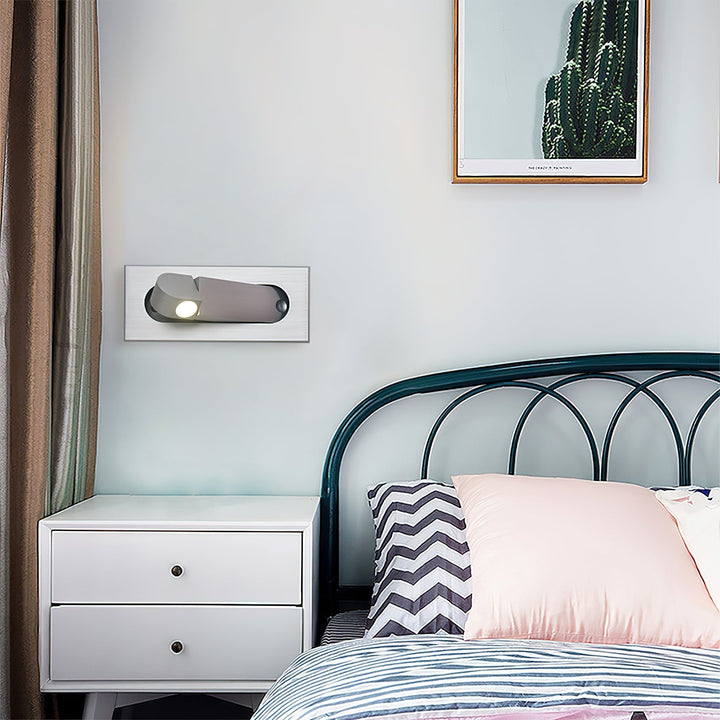Modern adjustable LED bedside lamp in matte black with a sleek design, featuring an adjustable head for focused reading light
