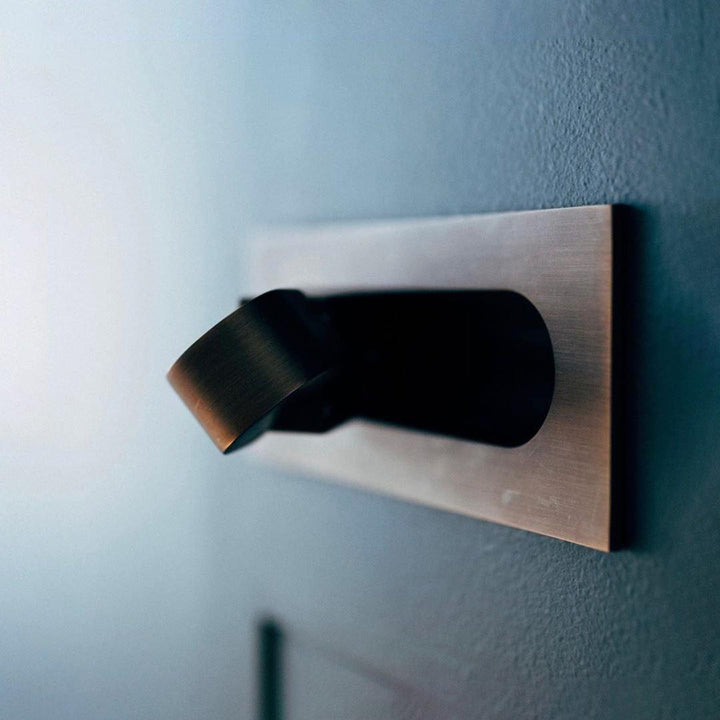 Modern adjustable LED bedside lamp in matte black with a sleek design, featuring an adjustable head for focused reading light