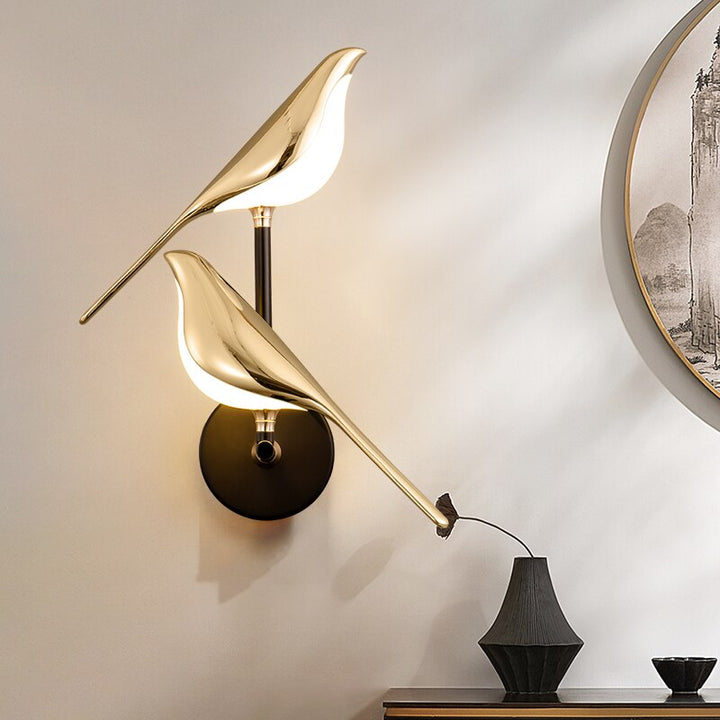 Modern bird-shaped wall lamp with magnetic attachment, featuring sleek LED lighting and elegant design for stylish interiors.