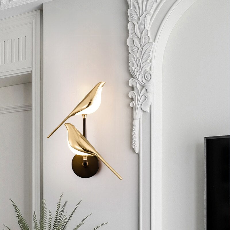 Modern bird-shaped wall lamp with magnetic attachment, featuring sleek LED lighting and elegant design for stylish interiors.