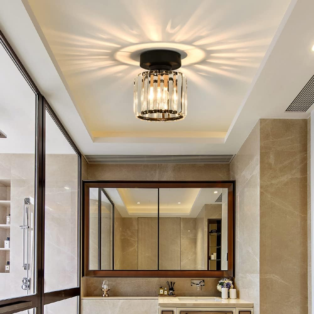 Modern black crystal flush mount ceiling light, sleek brass fixture, crystal shade, ideal for rooms with low ceilings.