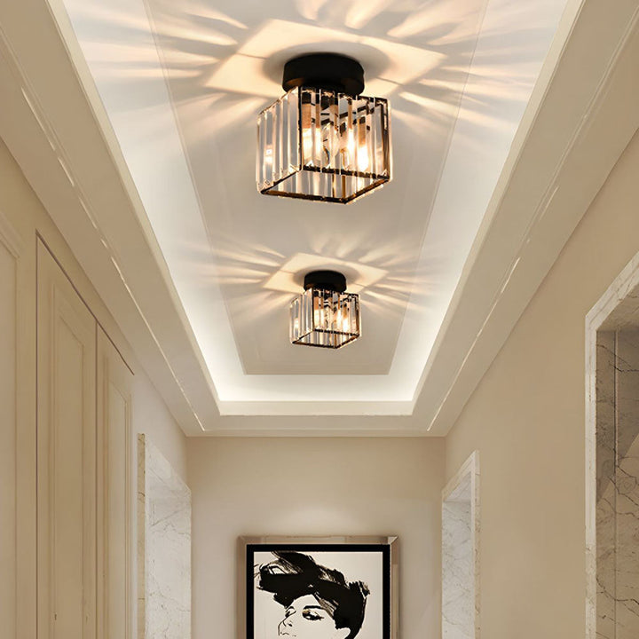 Modern black crystal flush mount ceiling light, sleek brass fixture, crystal shade, ideal for rooms with low ceilings.