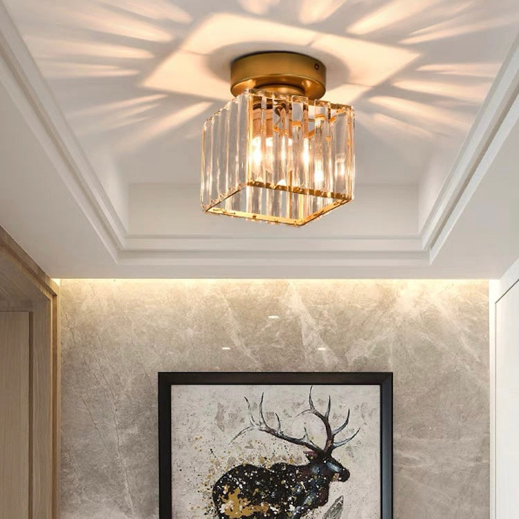 Modern black crystal flush mount ceiling light, sleek brass fixture, crystal shade, ideal for rooms with low ceilings.